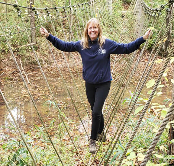 caucasian woman standing in forest